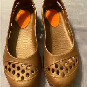 Sketchers plastic/rubber slip ons.  Good condition